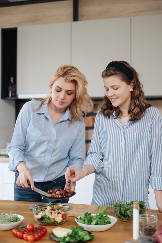 Home 6 mother and daughter teenager cooking together 2024 10 18 05 41 25 utc